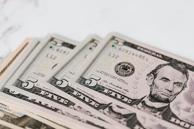 Several American five dollar bills